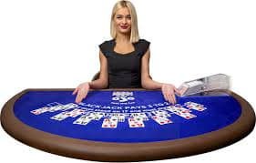 Close-up of cards being dealt on Dragon Tiger table with dealer hands visible